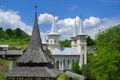 The old wooden Greek Catholic church and the new orthodox church in Poienile Izei, Maramures county.