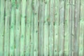 Old wooden green background of boards with cracked and paint. Fence. Wooden texture. Royalty Free Stock Photo