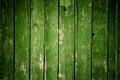 Old wooden green background of boards with cracked and peeling paint. Wooden texture. Fence Royalty Free Stock Photo
