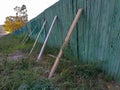 An old wooden fence supported by several boards in a row Royalty Free Stock Photo