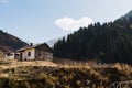 Old wooden grey house on a grassy hill Royalty Free Stock Photo