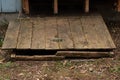 Old wooden hatch to crawlspace damaged and worn Royalty Free Stock Photo