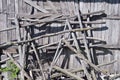 Old wooden hay stack constructions near barn wall Royalty Free Stock Photo
