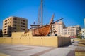 Old wooden boat called a Dhow outside the Dubai museum in UAE Royalty Free Stock Photo