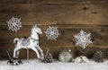 Old wooden horse on a background with snow. Nostalgic christmas Royalty Free Stock Photo