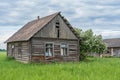 An old wooden house. Broken windows. House-by-house jasmine Royalty Free Stock Photo