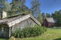 An old wooden house with a Church from the 1690s in the background in HDR Royalty Free Stock Photo