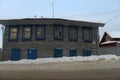 An old wooden house on the city street in winter Royalty Free Stock Photo