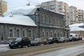 An old wooden house on the city street in winter Royalty Free Stock Photo