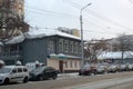 An old wooden house on the city street in winter Royalty Free Stock Photo