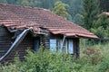 Old wooden house in disrepair on the edge of the village Royalty Free Stock Photo