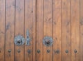 Old wooden house door and metal handles Royalty Free Stock Photo