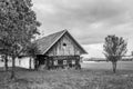 Old wooden house in empty field. Royalty Free Stock Photo