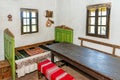 Old wooden house interior. Part of a traditional household from Serbia, details of furniture. Royalty Free Stock Photo