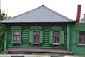 Old wooden house. The log house is painted green. Royalty Free Stock Photo