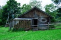 Old wooden house near the forest. Summer. Against the background Royalty Free Stock Photo