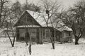 Old wooden abandoned house in russian viillage, monochrome image in retro style