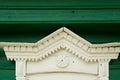 An old wooden house in a Russian village.Fragment of the tiles on the window. Historic building.