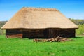 Old wooden house with straw roof