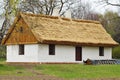 Old wooden house with straw roof Royalty Free Stock Photo