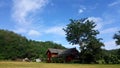 Old wooden house under the tree on mountain view, Village landscape