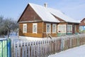 Old wooden house in village. Farmhouse in Belarus. View of rustic ethnic house in winter. rural landscape