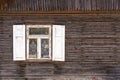 Old wooden house,window with open white shutters Royalty Free Stock Photo