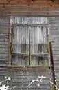 Old wooden house window shutters closed. Royalty Free Stock Photo