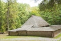 Old wooden house with a window and wooden roof in the forest, Royalty Free Stock Photo