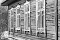 Old wooden house with windows in the garden black and white Royalty Free Stock Photo