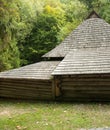 Old wooden house with wooden roof in the forest, background Royalty Free Stock Photo