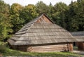 Old wooden house with wooden roof in the forest, background Royalty Free Stock Photo