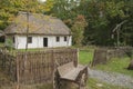 Old wooden house in the woods. Near the house, old horse-drawn background