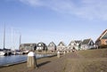 Old wooden houses at harbor of old dutch village Marken