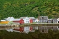 Old wooden houses with reflection at the pond, foot of the mountain in Laerdal, Norway Royalty Free Stock Photo