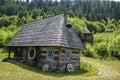Old wooden houses in the traditional style in the mountain village Kolochava, Ukraine