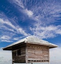 Old wooden hut with clouds float.