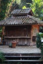 Old wooden hut that looks abandoned in the middle of a tropical forest. Royalty Free Stock Photo