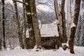 Old wooden hut in a romantic snowy landscape Royalty Free Stock Photo