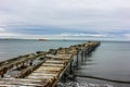 Old wooden jetty on Patogonia beach Royalty Free Stock Photo