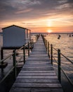 An old wooden jetty or pier at sunrise Royalty Free Stock Photo