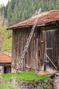 Old wooden ladder in front of historic barn Royalty Free Stock Photo