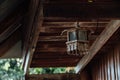 Old wooden lamp on the terrace near the house Royalty Free Stock Photo