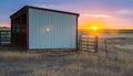 Steel and Wood Pole Barn for Livestock at Sunset Royalty Free Stock Photo