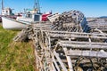 Old wooden lobster traps and fishing boats Royalty Free Stock Photo