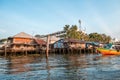 Old wooden local houses along the Chao Phraya riverside. Royalty Free Stock Photo