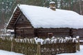 Old wooden log house covered with snow Royalty Free Stock Photo