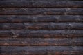 Old wooden log house wall, rural background texture Royalty Free Stock Photo