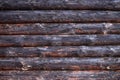Old wooden log house wall, rural background texture Royalty Free Stock Photo