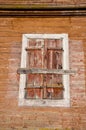 Old wooden manor house wall with windows shutter